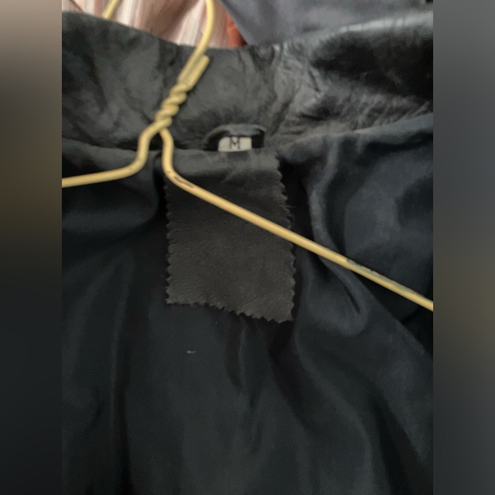 Medium size leather jacket. No brand listed